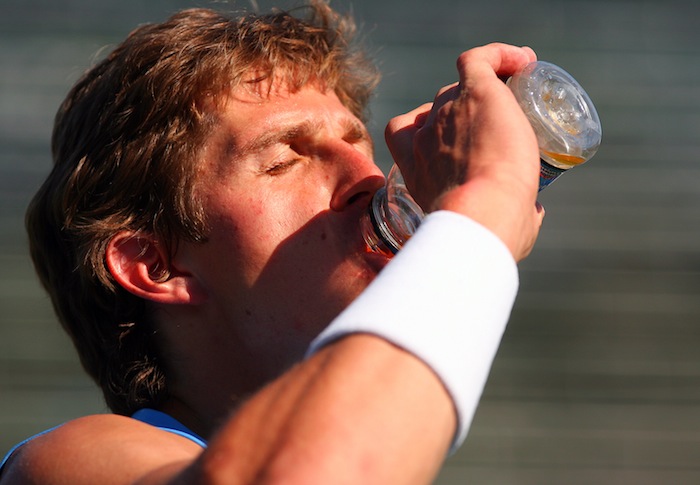 Igor Andreev drinking out of bottle